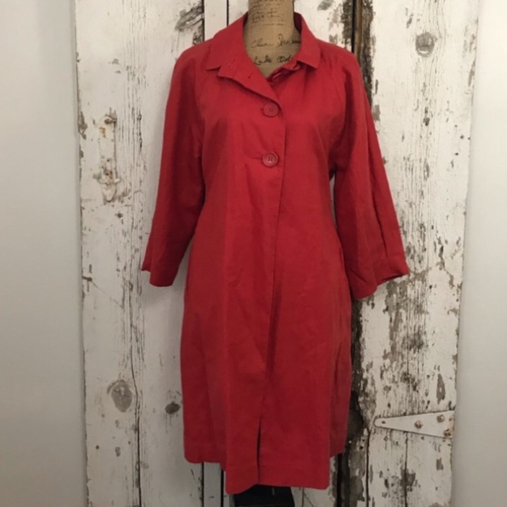 Knee length red belted trench coat